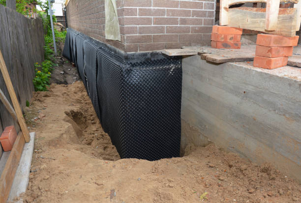 SJ Waterproofing Pros technician performing targeted Waterproofing assessment in New London, WI